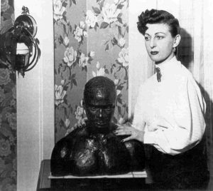 1952 publicity photo for the Canada Lee Foundation of Frances Lee posing with a bust of Canada Lee.  