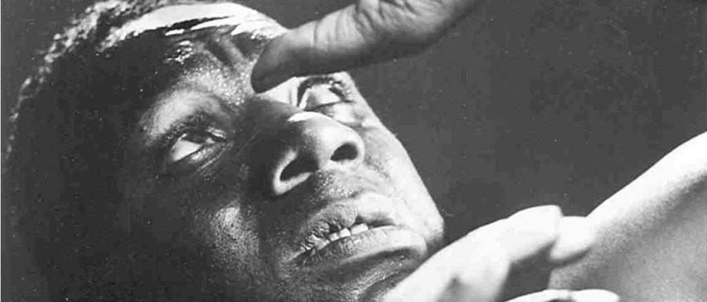 Photo of Canada Lee with his hands above his face (during production of Native Son). From a photo series by Fritz Hende.